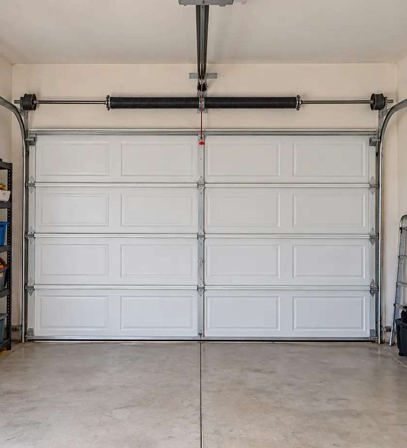 Level garage door with repaired springs and technician inspection